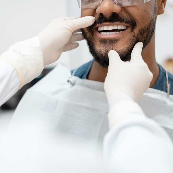 close up of mans teeth at the dentist