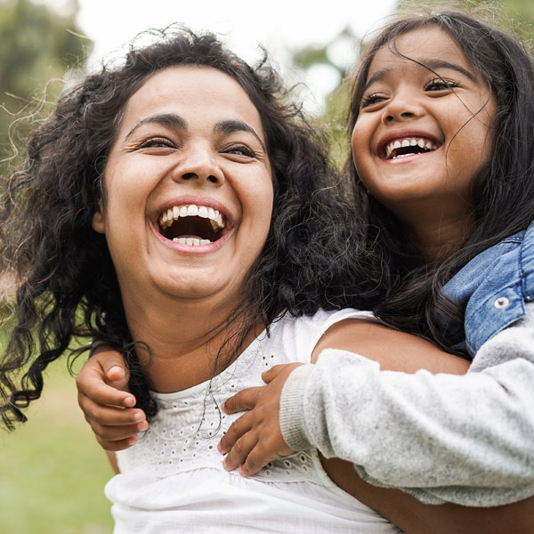 woman smiling with her daughter